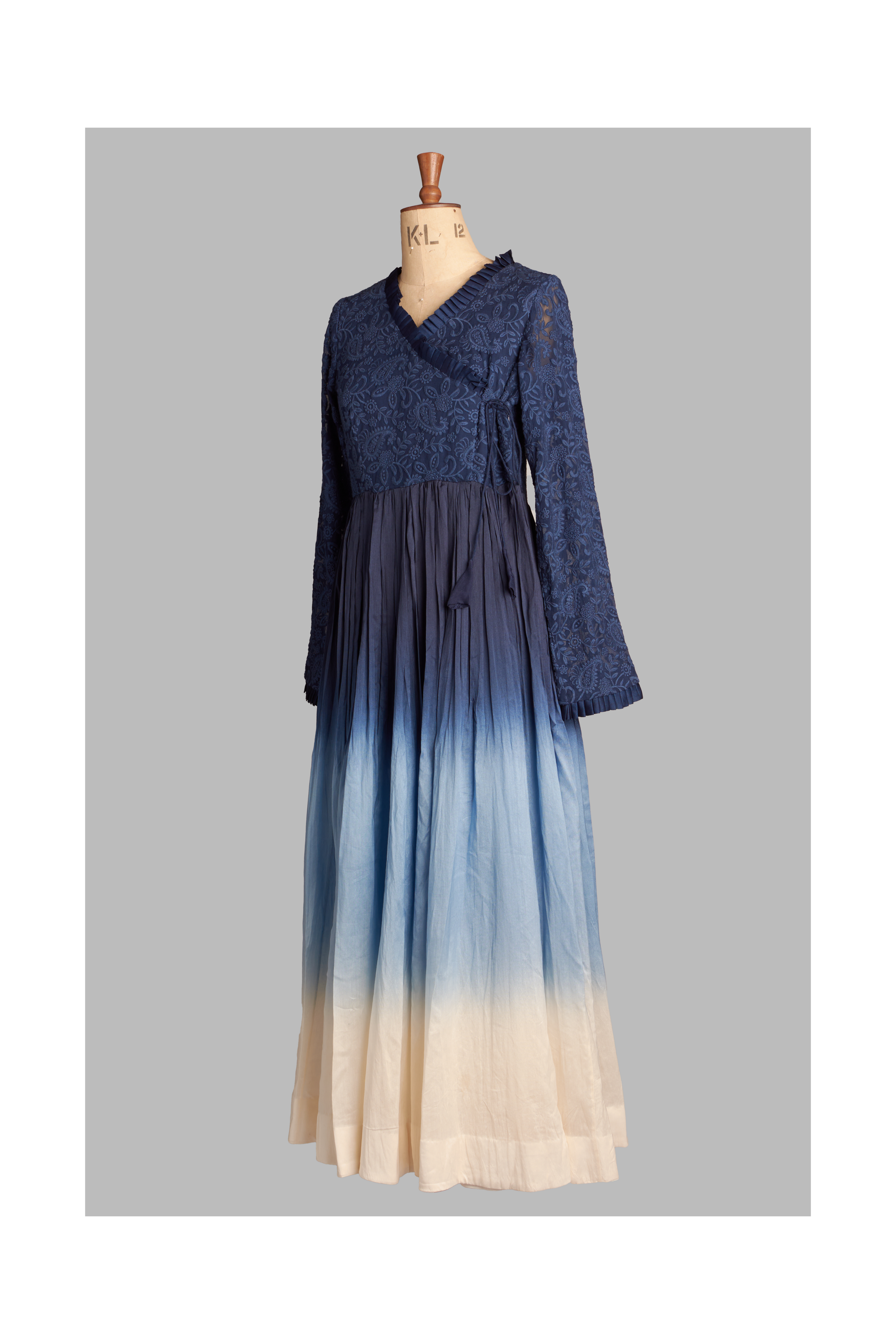 Navy blue outfit with gradient effect on a mannequin against a gray background