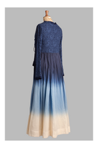 Mannequin wearing a blue gradient outfit with blue and beige colors on a gray background