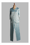 Light blue pajama set with a pattern on a mannequin against a gray background